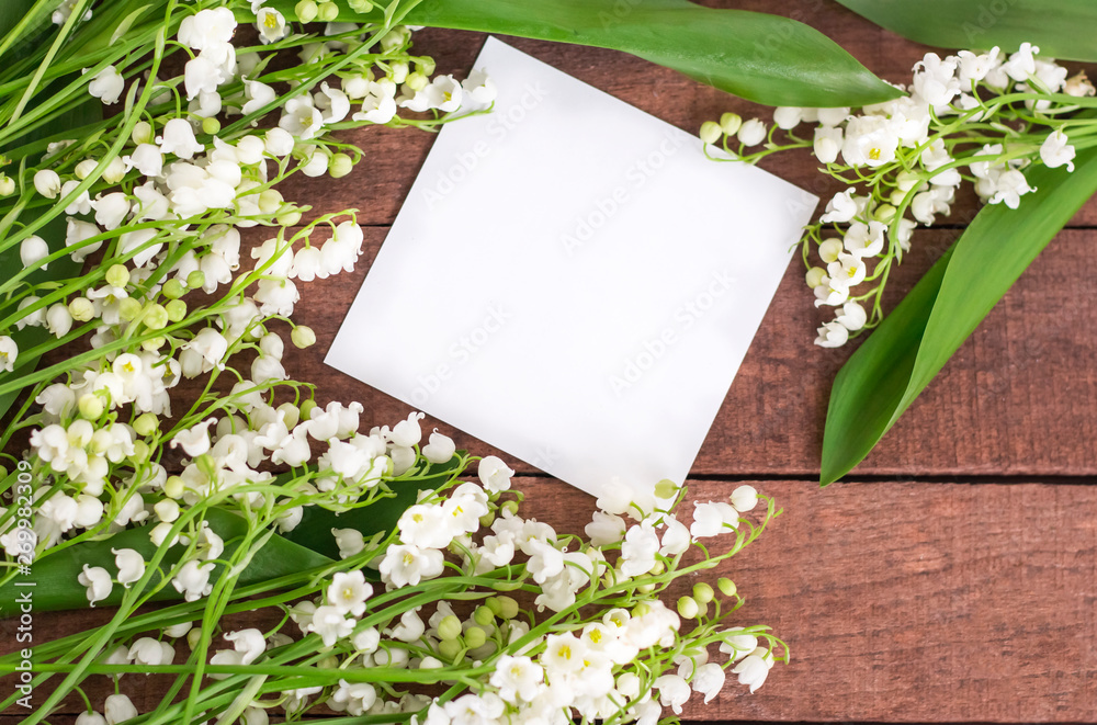 flat lay white lilies of the valley on the wooden surface of the copy space flat lay white lilies of the valley on the wooden surface of the copy space