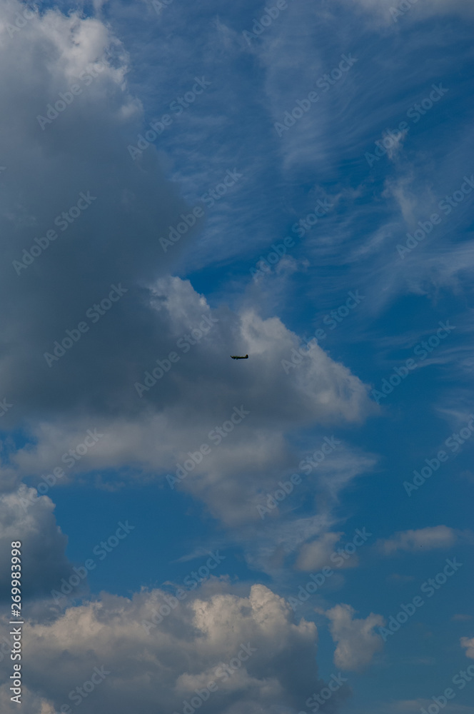 light aircraft against the sky with clouds