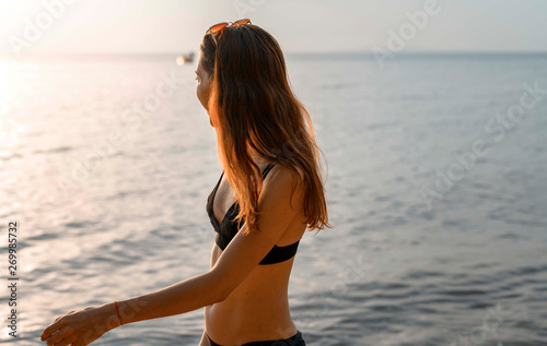 Fototapeta Naklejka Na Ścianę i Meble -  Beautiful girls in bikini  on the beach