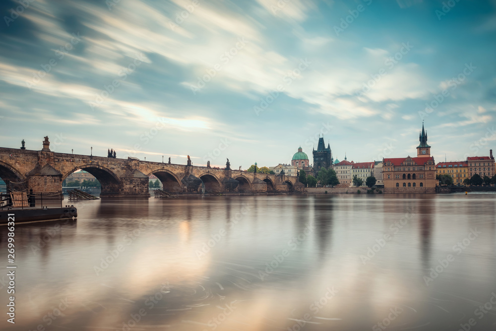 Fototapeta premium Beautiful morning view with Vltava river and Charles bridge in Prague, Czech Repiblic
