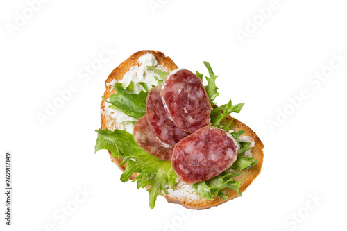 Sandwich with sausage, salad and cheese on a white background.