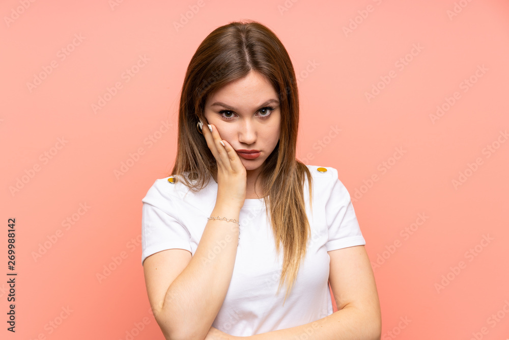 Teenager girl over isolated pink wall unhappy and frustrated Teenager girl over isolated pink wall unhappy and frustrated