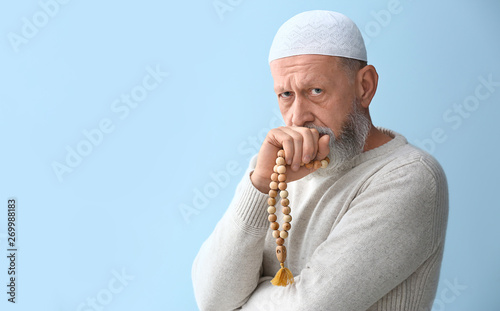 Senior Muslim man with tasb...