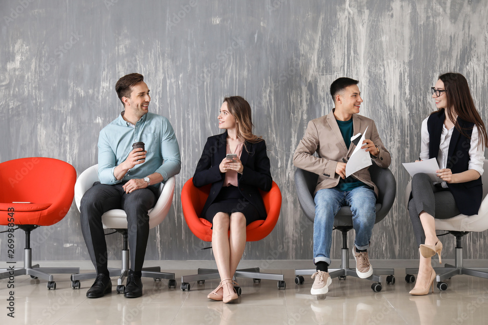 Young people waiting for job interview indoors Young people waiting for job interview indoors
