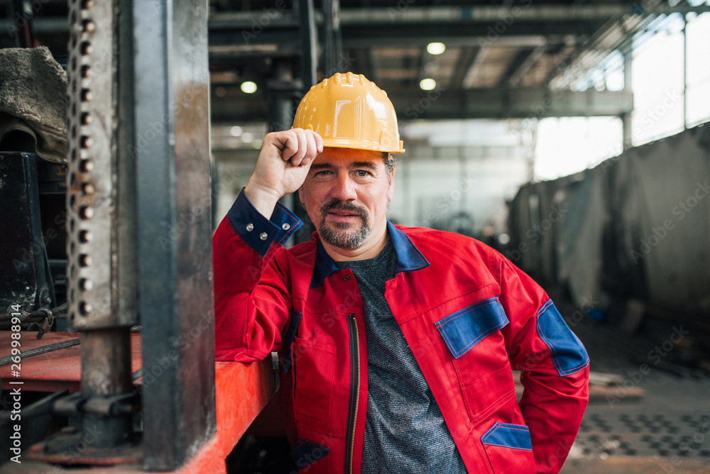Portrait of a confident mature factory worker. Portrait of a confident mature factory worker.