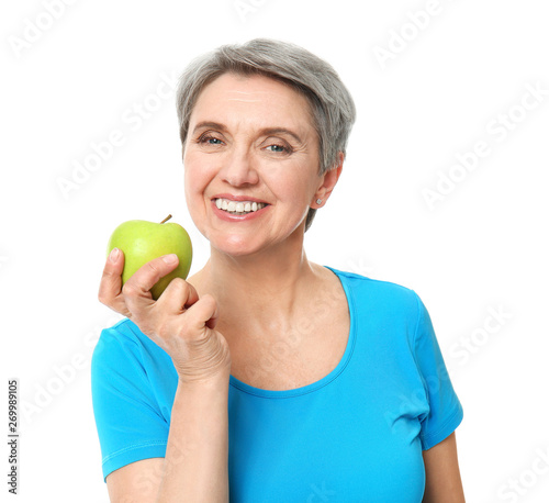 Mature woman with apple on ...