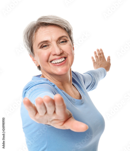 Sporty mature woman on whit...