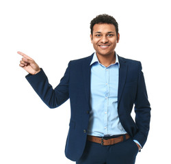 Handsome businessman pointing at something on white background