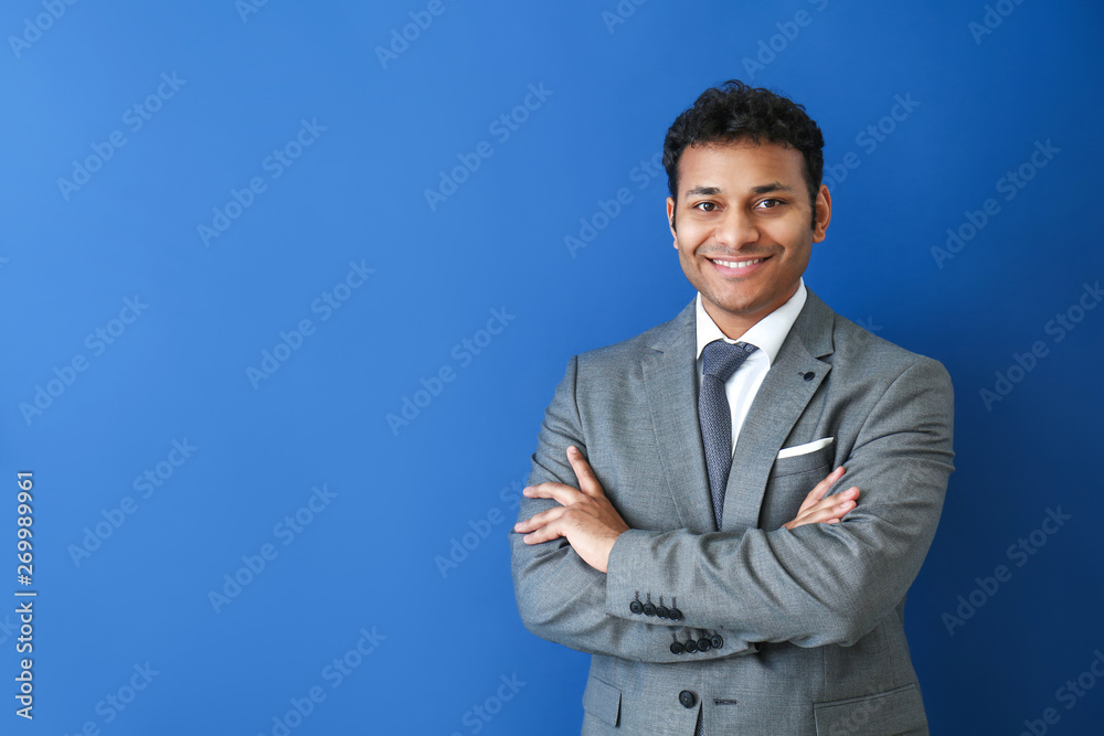 Handsome businessman on color background Handsome businessman on color background