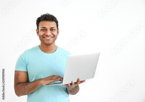 Happy man with laptop on wh...