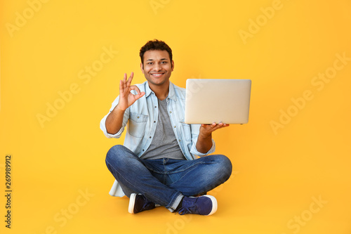 Handsome man with laptop sh...