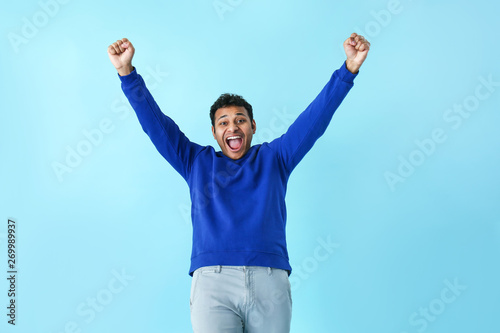 Happy handsome man on color...