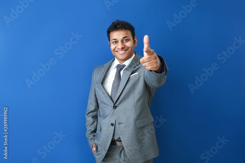 Handsome businessman pointi...