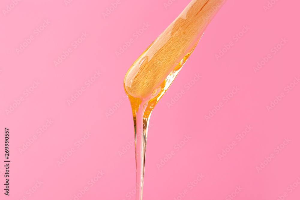 Stick with sugaring paste on color background Stick with sugaring paste on color background
