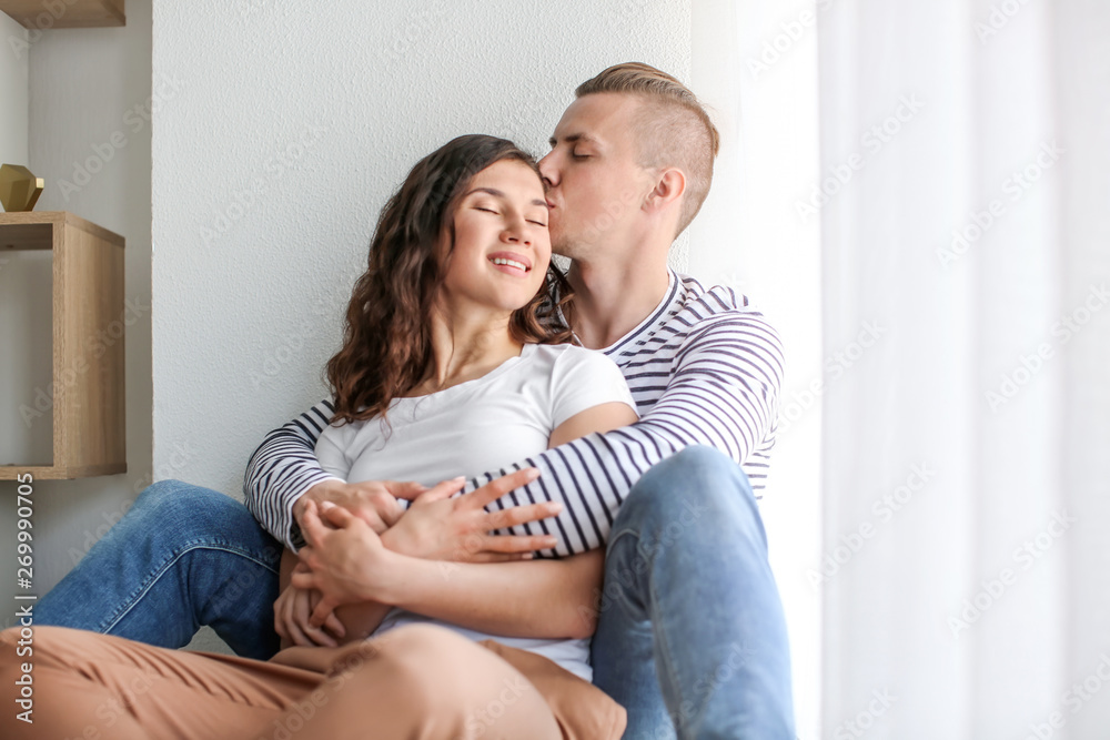 Adorable loving couple resting at home Adorable loving couple resting at home
