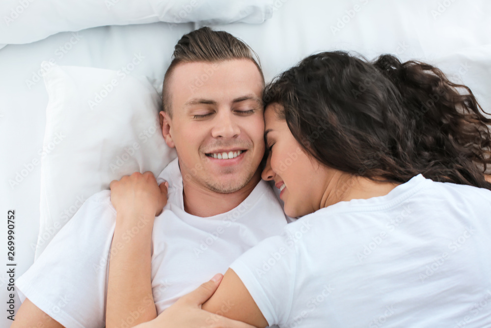 Adorable loving couple sleeping in bed Adorable loving couple sleeping in bed