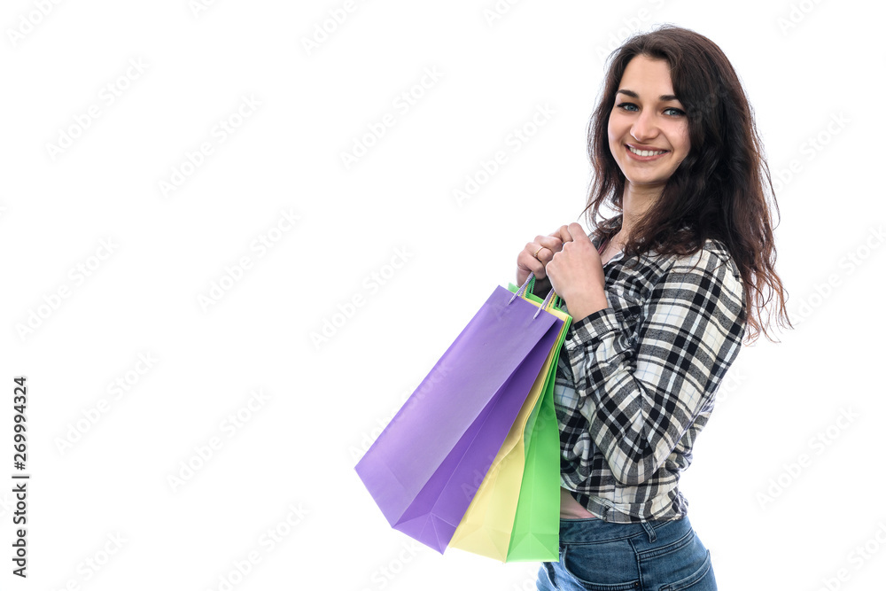 Young woman with colorful shopping bags isolated on white