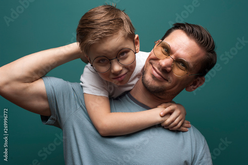 Happy smiling father and his little kid