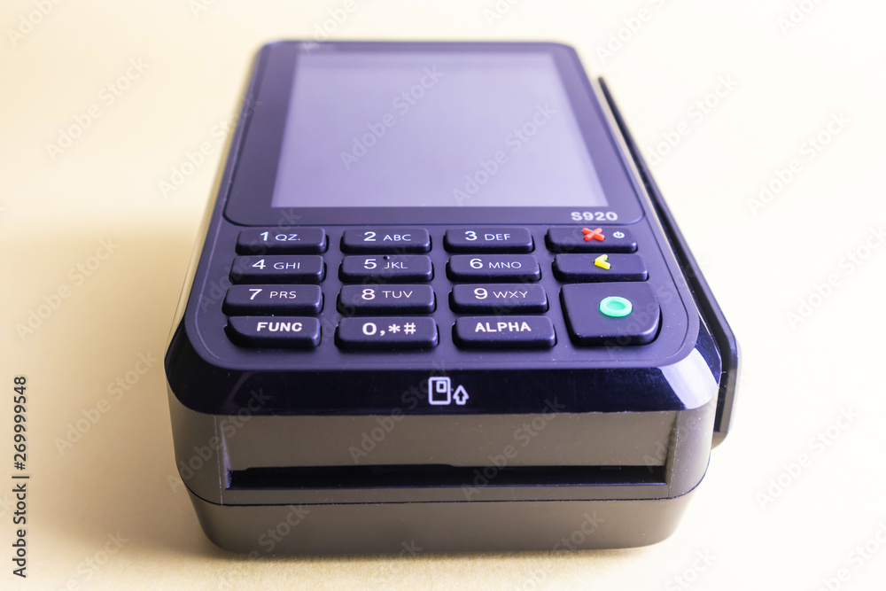 Pos terminal on a light background. Banking equipment. Acquiring. Acceptance of bank credit cards. Contactless payment.
