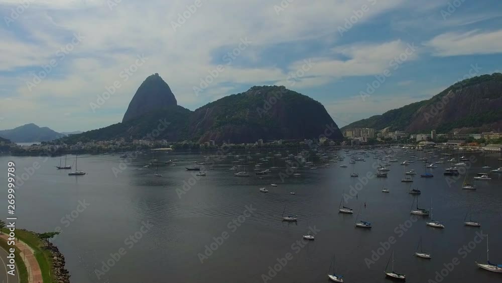Pao Acucar or Sugar loaf mountain and the bay of Botafogo, Plane passing Rio de Janeiro, Brazil, South America Pao Acucar or Sugar loaf mountain and the bay of Botafogo, Plane passing Rio de Janeiro, Brazil, South America