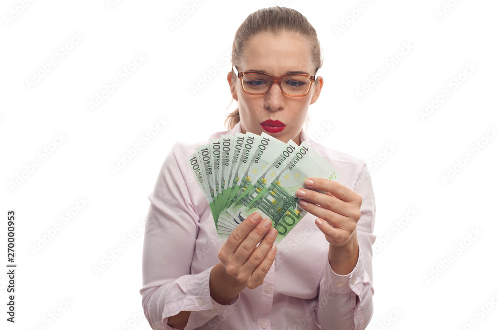 Portrait of young woman holding 100 euro cash fan Portrait of young woman holding 100 euro cash fan