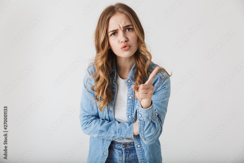 Attractive young girl standing isolated over white Attractive young girl standing isolated over white