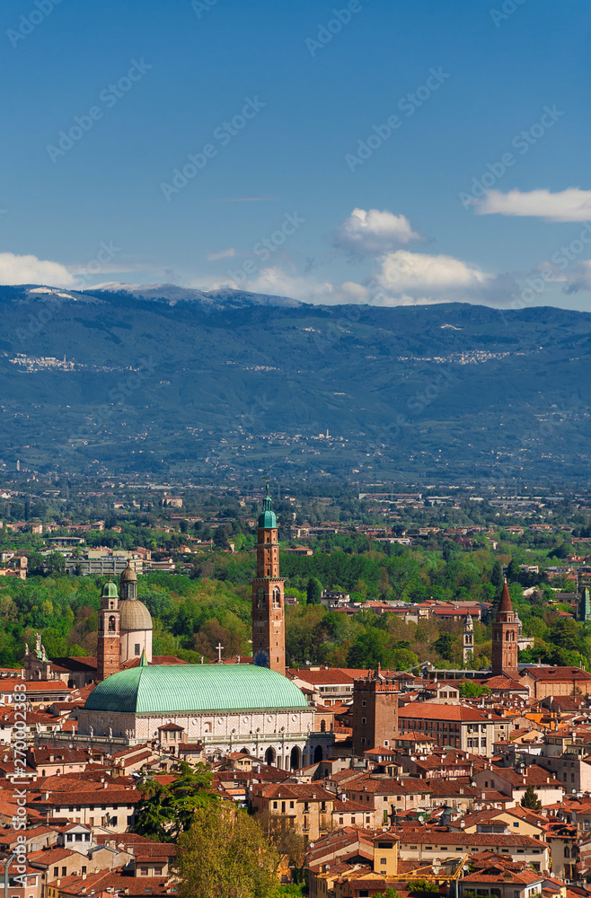 View of Vicenza historic center with the famous renaissance Basilica Palladiana and nearby mountains, from Mount Berico (with copy space above)