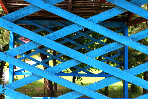 Old wooden lattice on nature background. Wooden trellis
