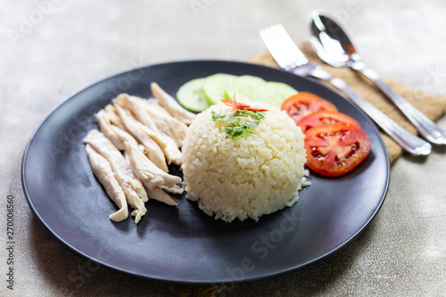 Hainanese chicken rice with cucumber , "Khao Man Kai".