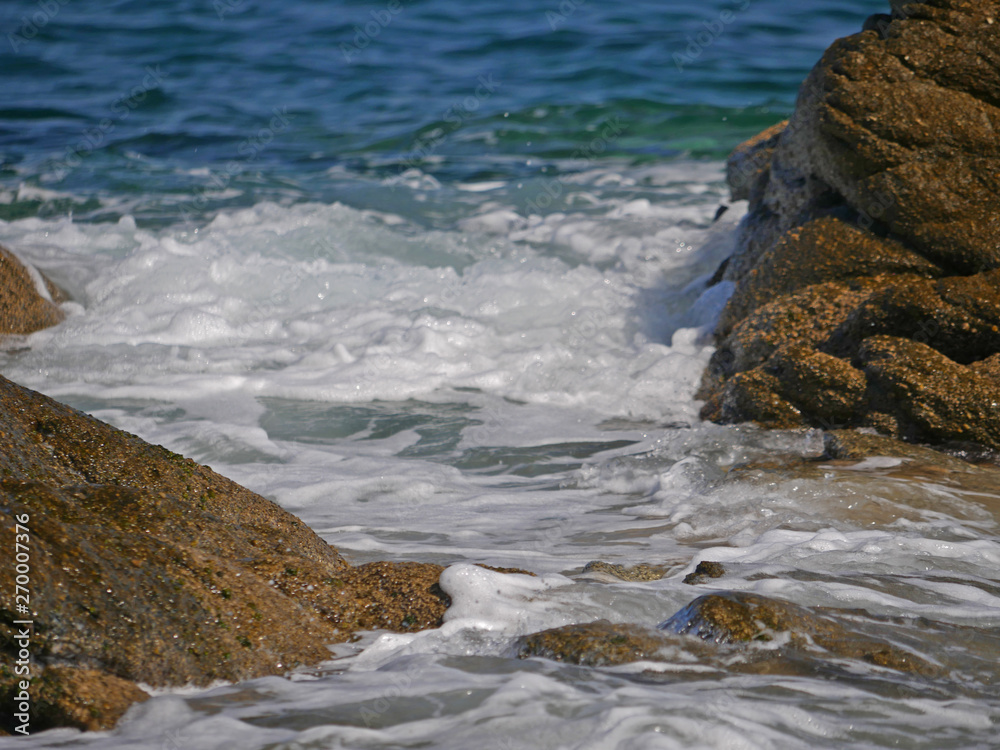 Waves crashing against the rock