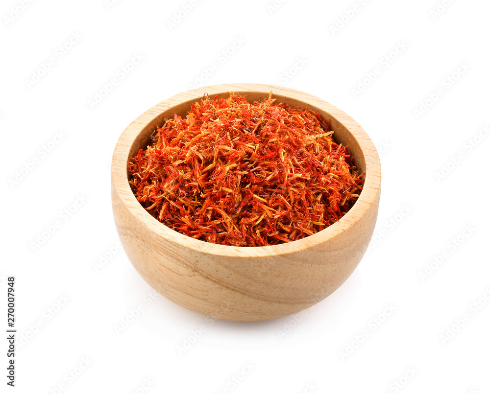 Safflower dried in wood bowl on white background Safflower dried in wood bowl on white background