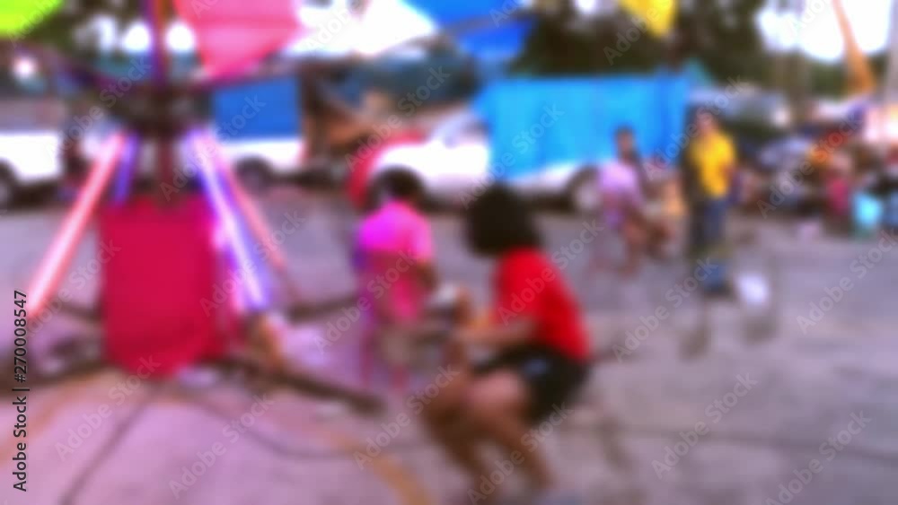 Blur of children swing in fair playground. Blur of children swing in fair playground.