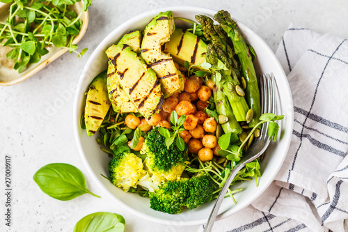 Fotografija Buddha bowl with grilled avocado, asparagus, chickpeas, pea sprouts and broccoli