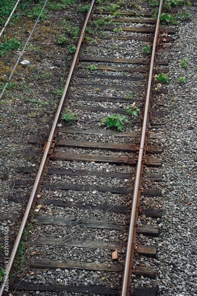 train railroad tracks in the street in the station train railroad tracks in the street in the station