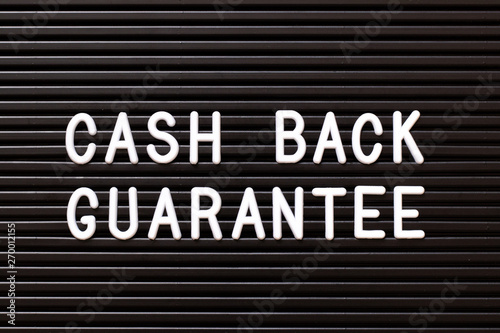 Black color felt letter board with white alphabet in word cash back guarantee background