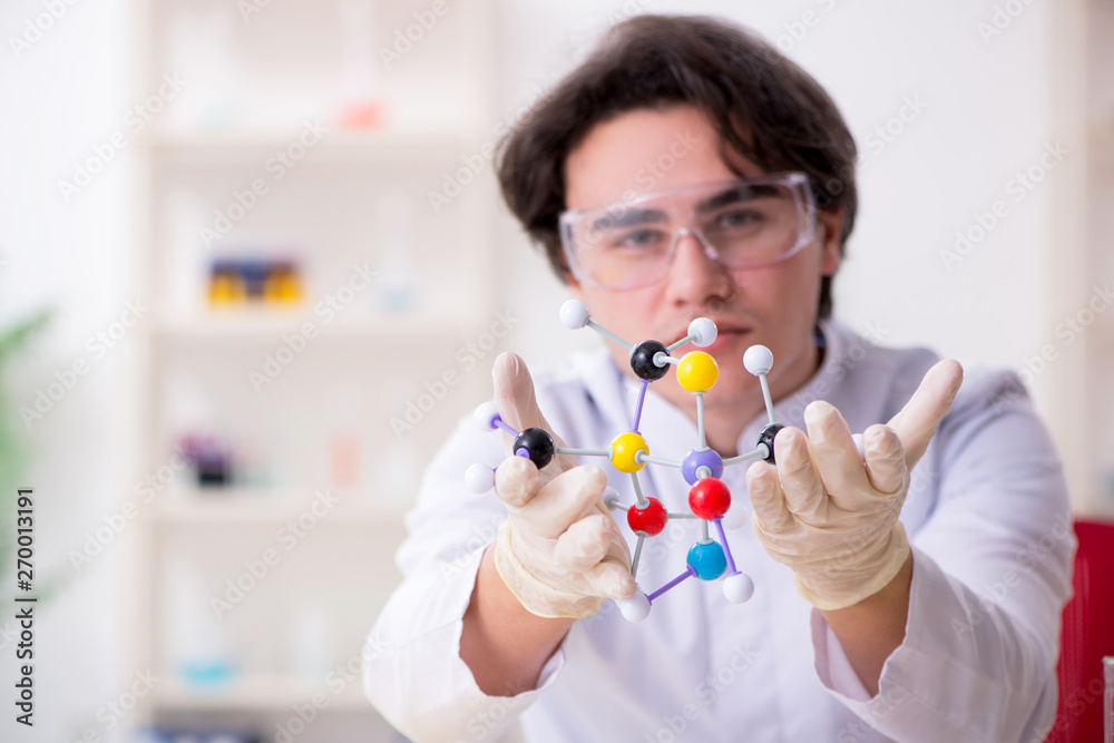 Young male biochemist working in the lab Young male biochemist working in the lab