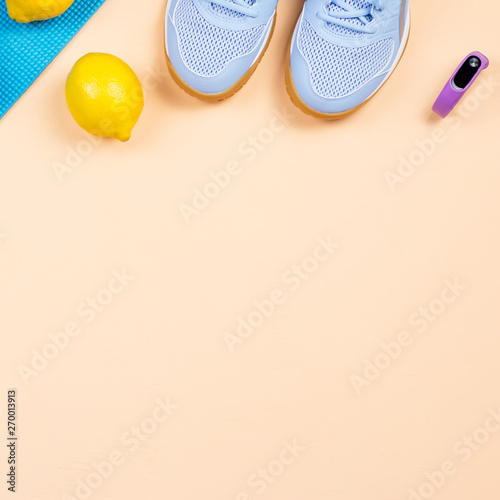 Fitness equipment. Woman workout accessories and clothes lay out. Top view, fitness background © Maria Shchipakina
