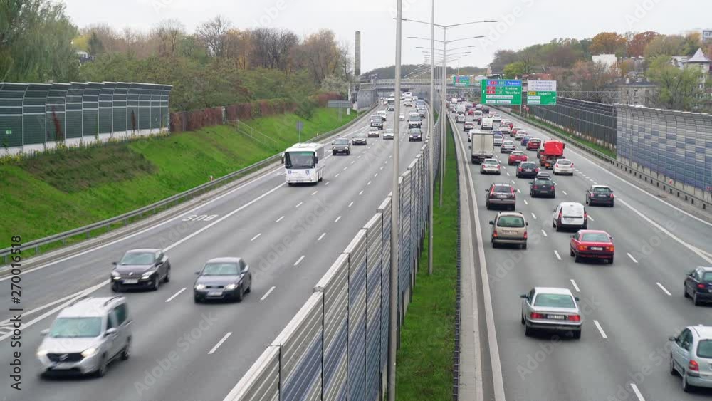 Cars leaving and entering the tunnel on the expressway in Warsaw, Poland in the afternoon. Cars leaving and entering the tunnel on the expressway in Warsaw, Poland in the afternoon.