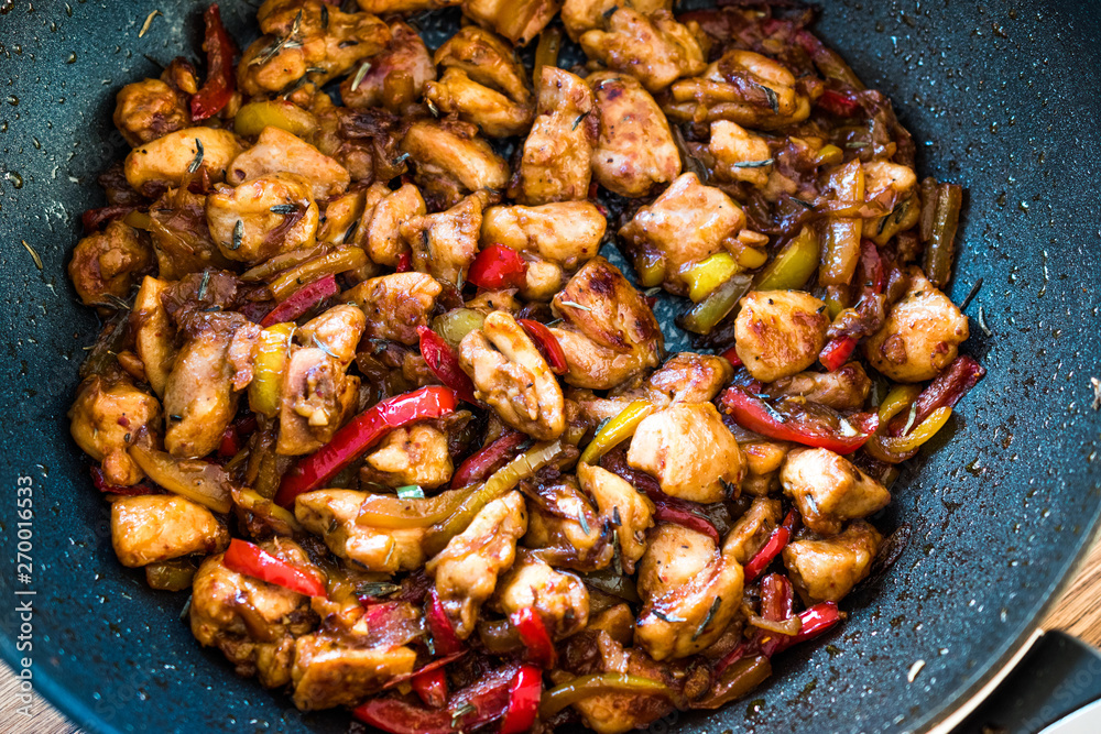 Manchurian Chicken with Soy Sauce, Julienne Vegetables in Iron Wok Pan / Asian Style Cooking Manchurian Chicken with Soy Sauce, Julienne Vegetables in Iron Wok Pan / Asian Style Cooking