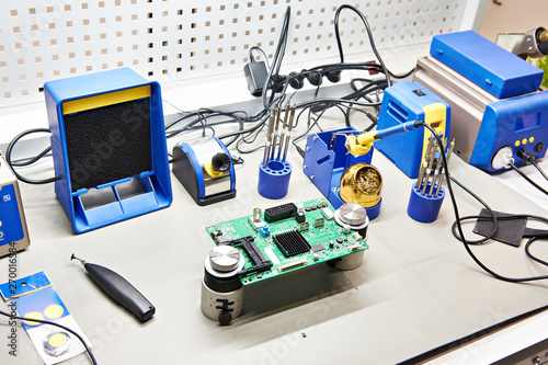 Workplace with soldering iron and tool for electronic