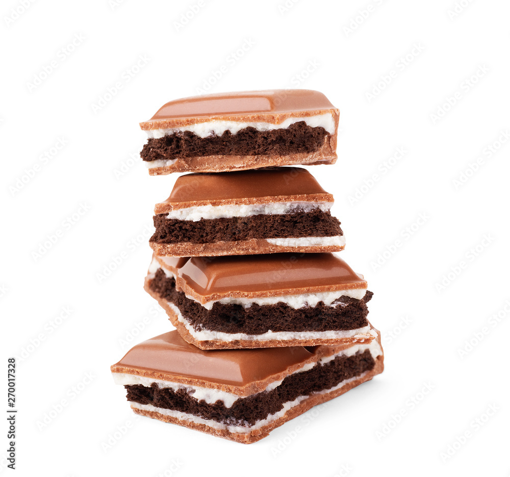 Chocolate broken into pieces on a white background Chocolate broken into pieces on a white background