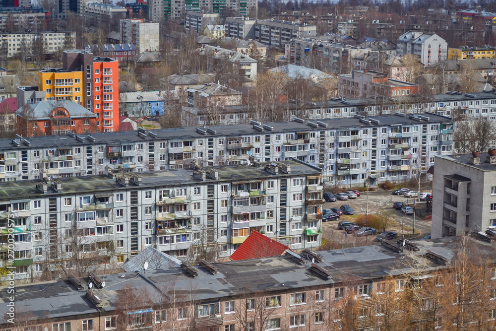 View of the city from a height. Multi-storey residential building area. Old sleeping quarters