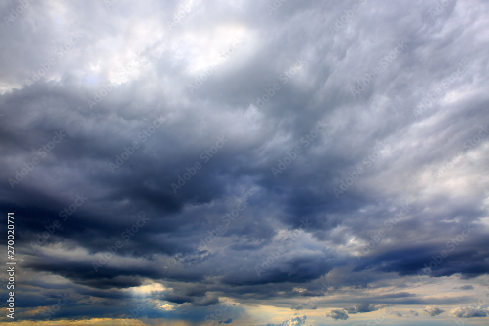 Obraz premium Dark big grey storm clouds. Dramatic sky.