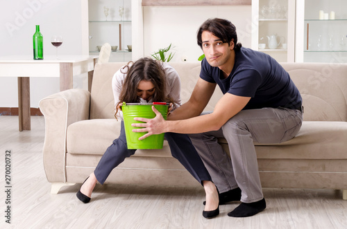 Young wife suffering from sick stomach and vomiting photo