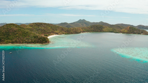 group tropical islands with white sand beach and blue clear water. aerial view seascape Philippines Palawan  Bulalacao
