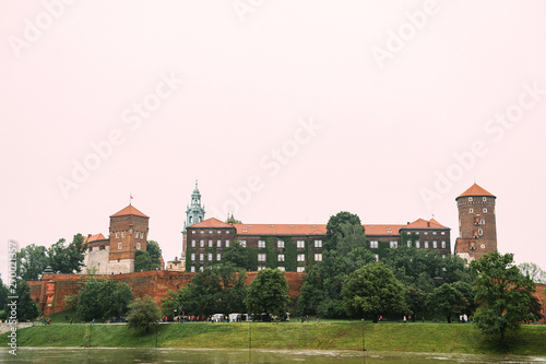Scenic view at Wawel castle in Cracow city (Krakow), Poland, from Vistula river (Wisla) quay in summer day.