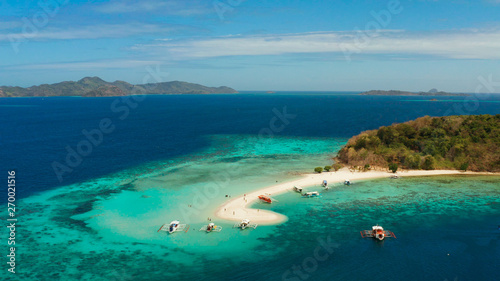 aerial seascape tropical island with sand bar, turquoise water and coral reef. Ditaytayan, Palawan, Philippines. tourist boats on tropical beach. Travel tropical concept. Palawan, Philippines