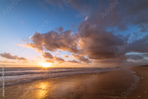 Tropical beach sunrise landscape with beautiful sky © Olga K