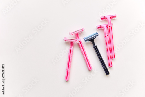 set of shaving razors. female and male, blue and pink color on a white isolated background