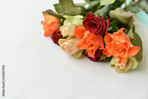 mixed colorful bouquet of various roses on white isolated background